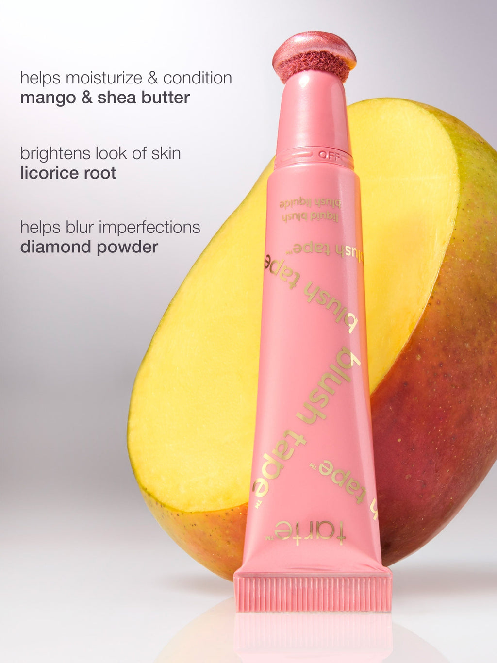 Pink skincare product with mango and shea butter on a light gray background