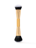 tarte Makeup brush with black bristles on a white background