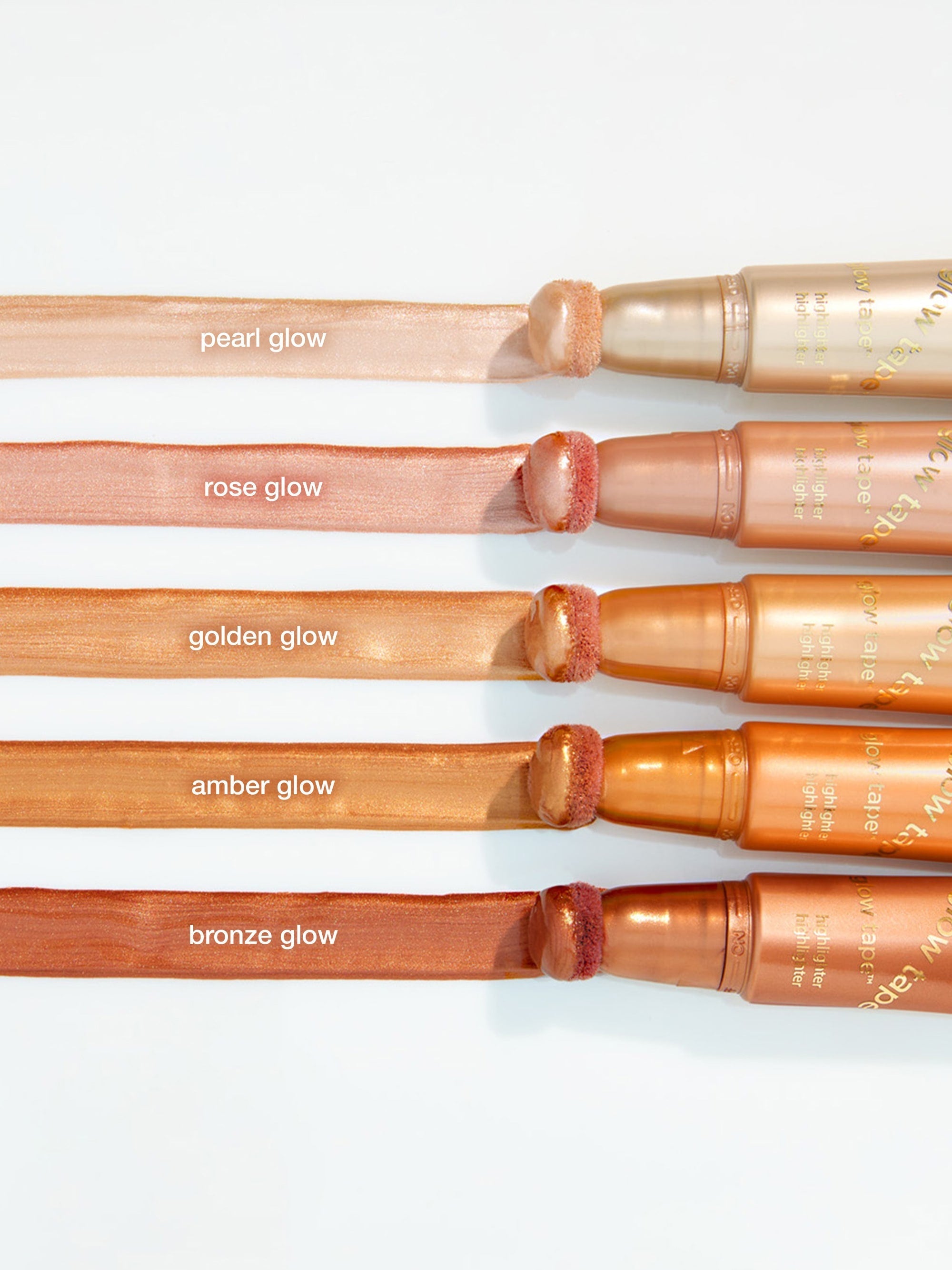 Set of makeup brushes with different colored bristles on a white background