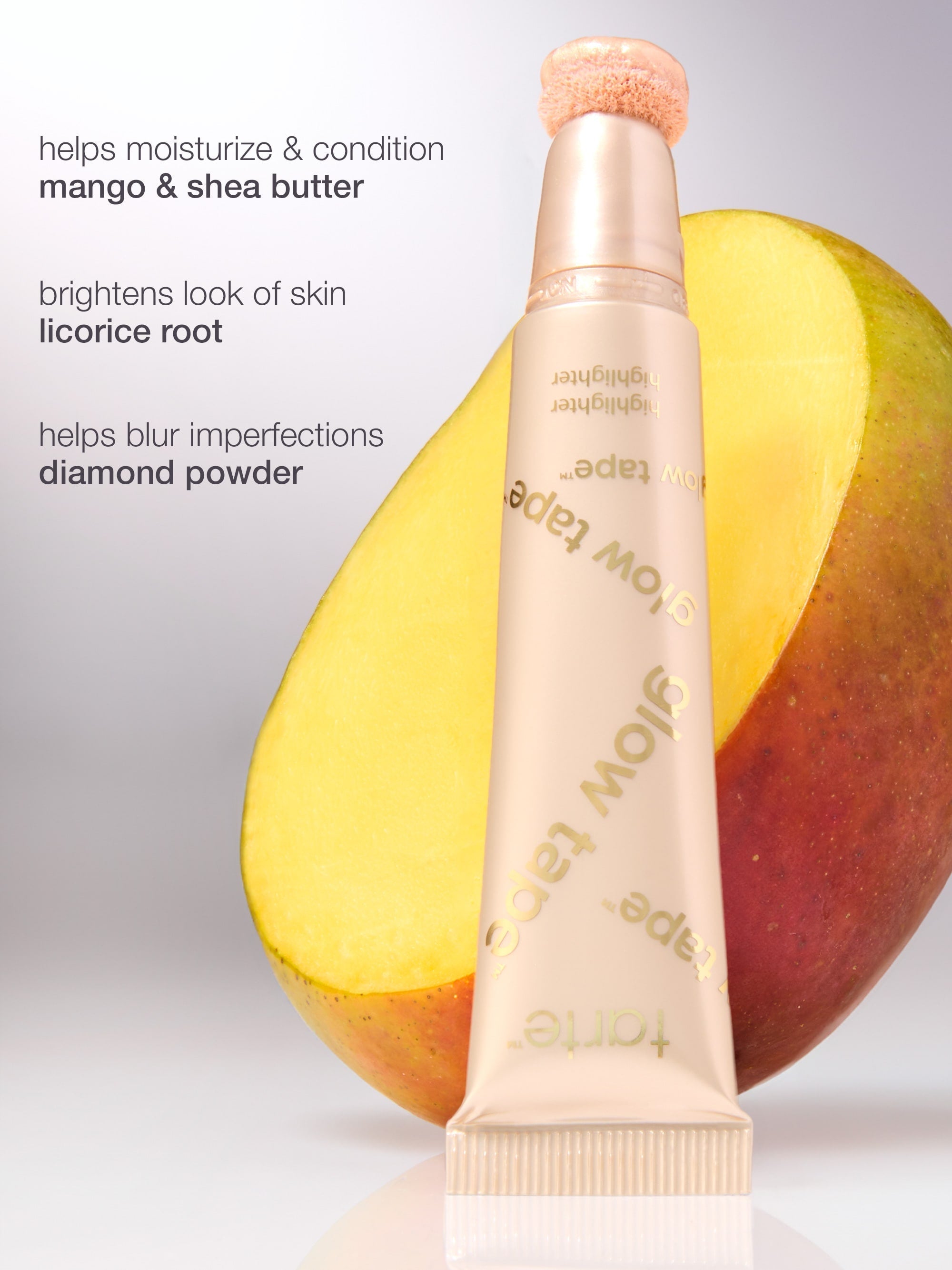 Skincare product with ingredients listed next to a mango on a gray background