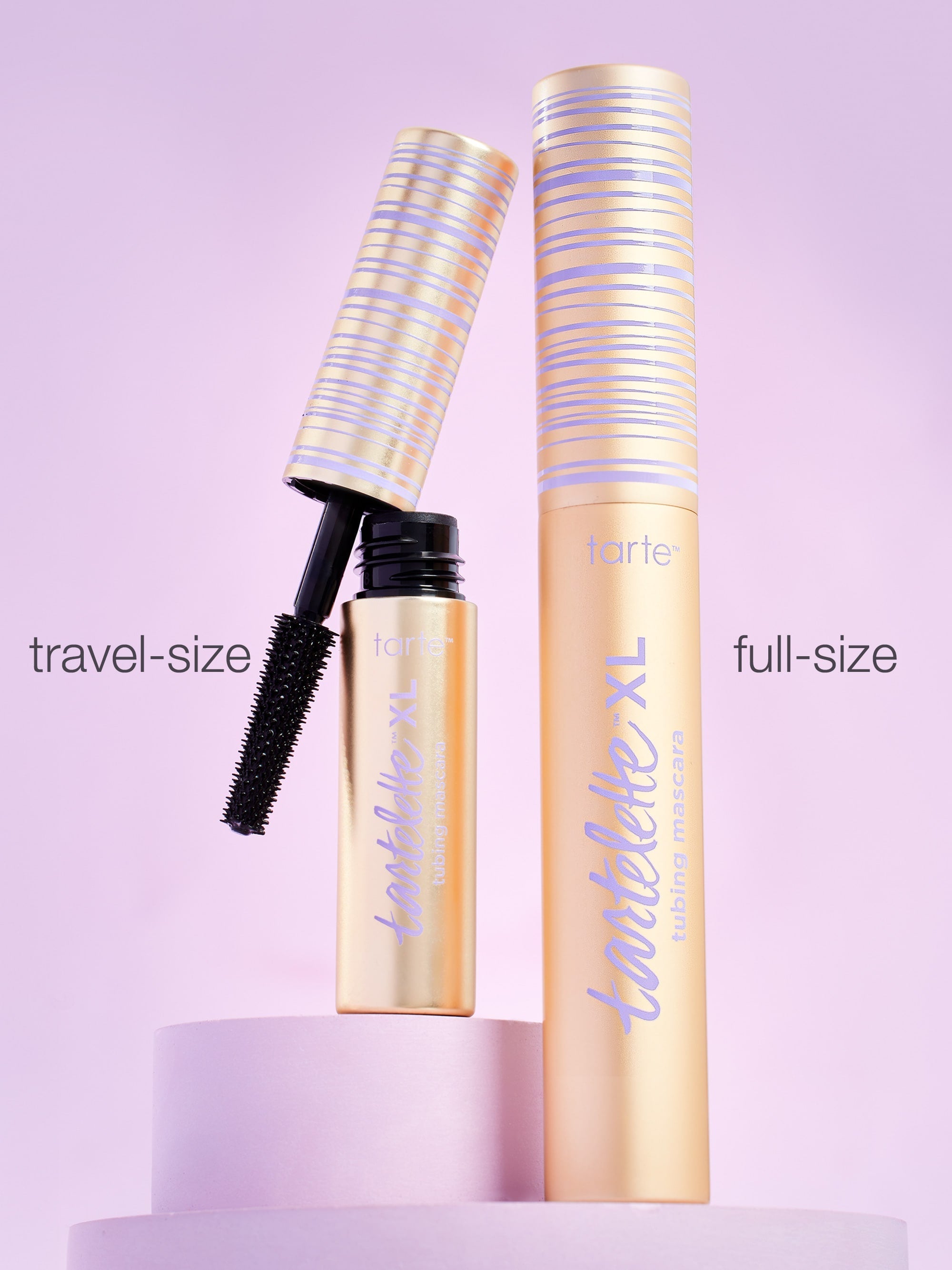 Tartelette XL mascara with travel-size and full-size versions on a light purple background