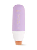 Lavender bottle with a white cap labeled 'Maracuja Juicy Glow' on a white background