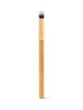 Makeup brush with a wooden handle on a white background