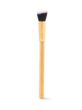 Makeup brush with wooden handle and black bristles on a white background