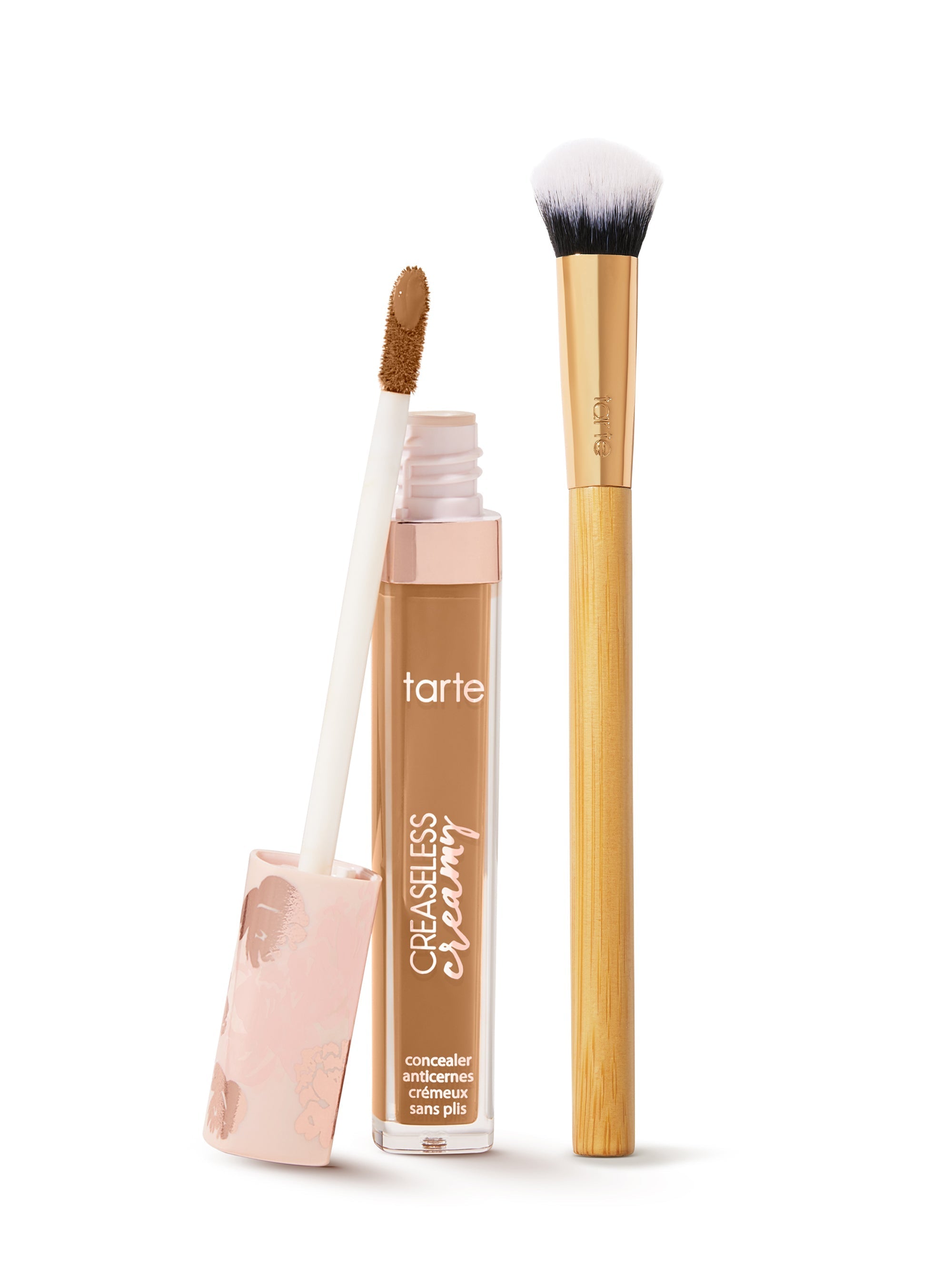  tarte creaseless creamy concealer  with applicator and brush on a white background
