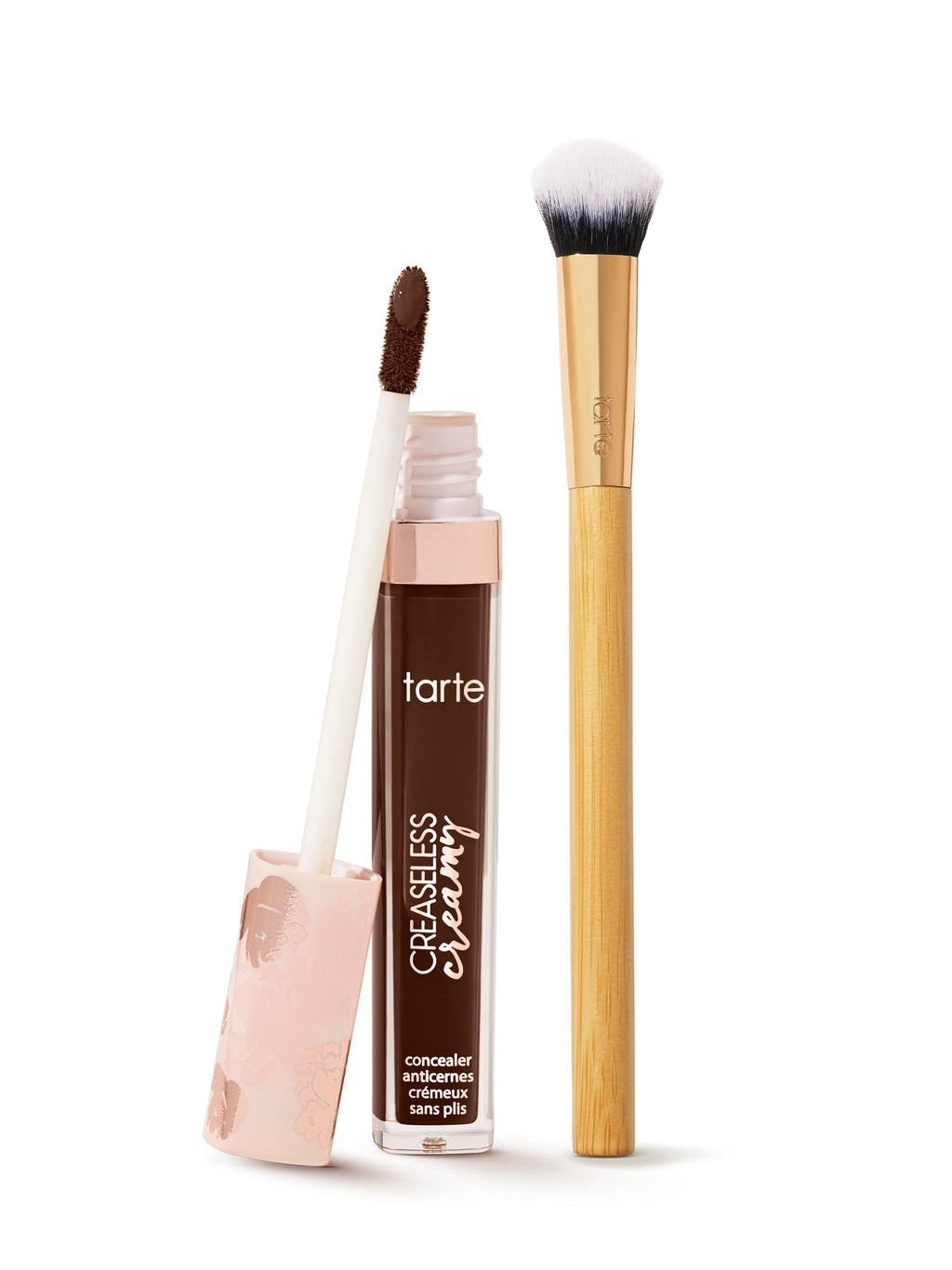  tarte creaseless creamy concealer  with applicator and brush on a white background