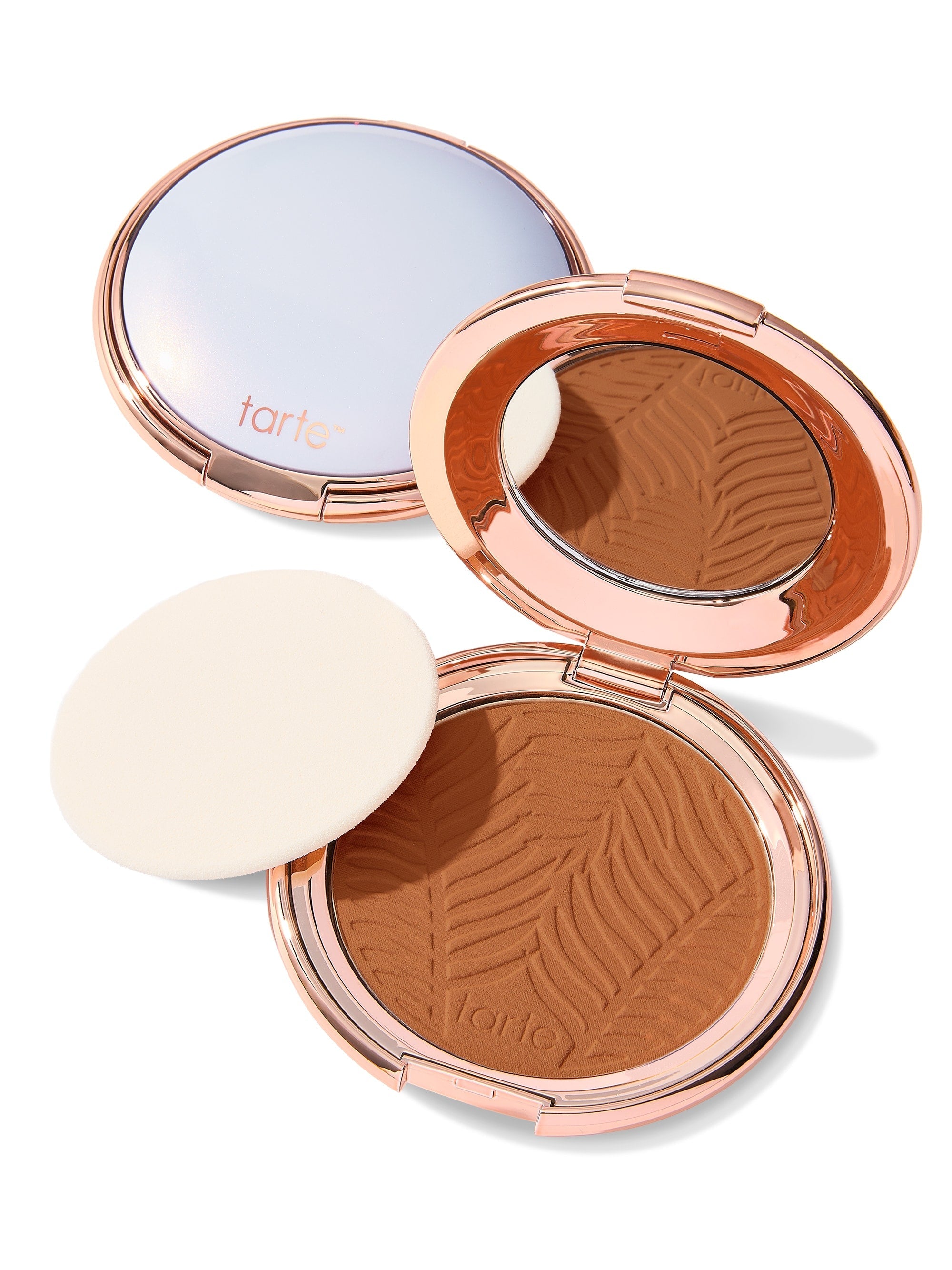 Compact powder with zebra pattern in a rose gold case on a white background