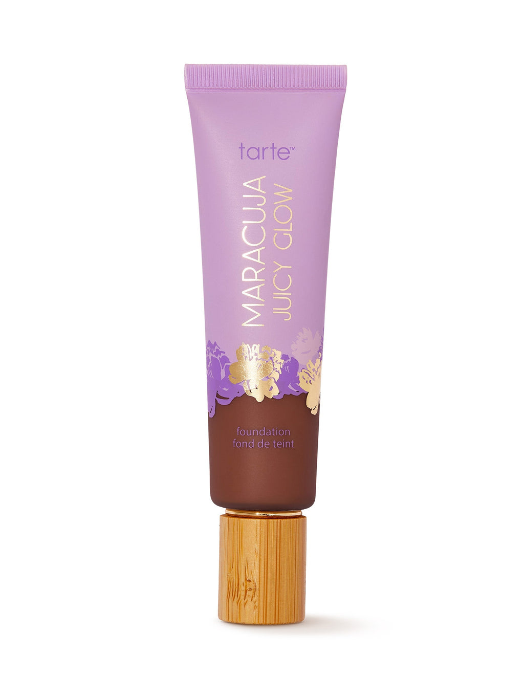 Tarte Maracuja Juicy Glow foundation tube with wooden applicator on a white background